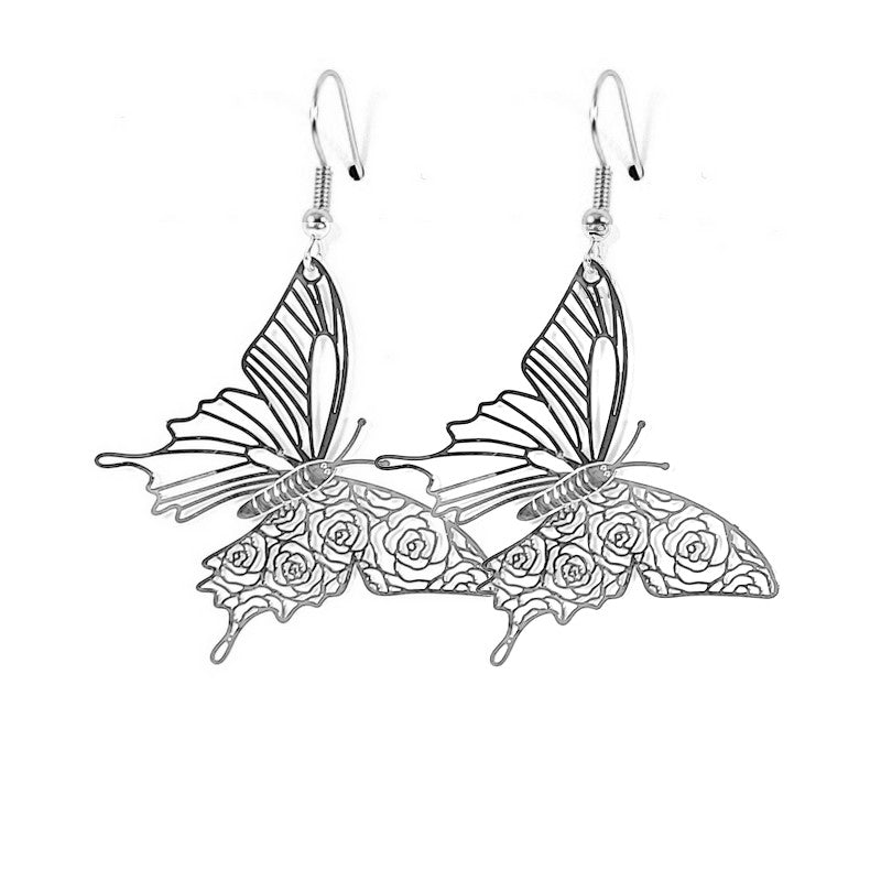 Fancy filigree butterfly drop earrings in silver color