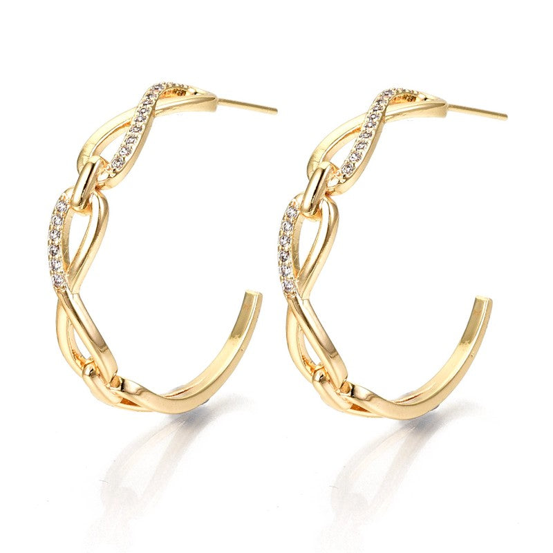 Boucles d'oreilles demi-Créoles avec le sigle infini serti de zirconium