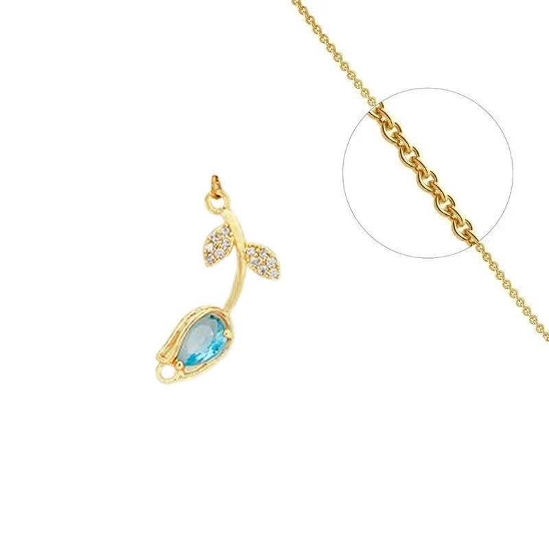 Chain necklace and flower pendant with blue set zirconiums