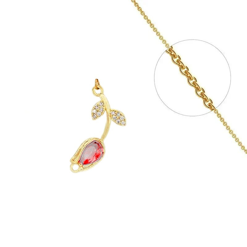 Chain necklace and flower pendant with red set zirconiums